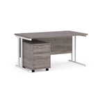 Gray office desk with a matching pedestal on a white background