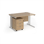 Wooden office desk with three drawers on a white background