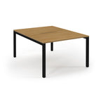 Square table with wooden top and black metal legs on a white background