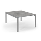 Square table with a grey wooden top and metal legs on a white background