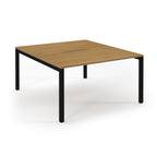Square wooden table with black metal legs on a white background