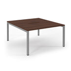 Square table with wooden top and metal legs on a white background