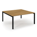 Square wooden table with black metal legs on a white background