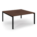 Square wooden table with black metal legs on a white background