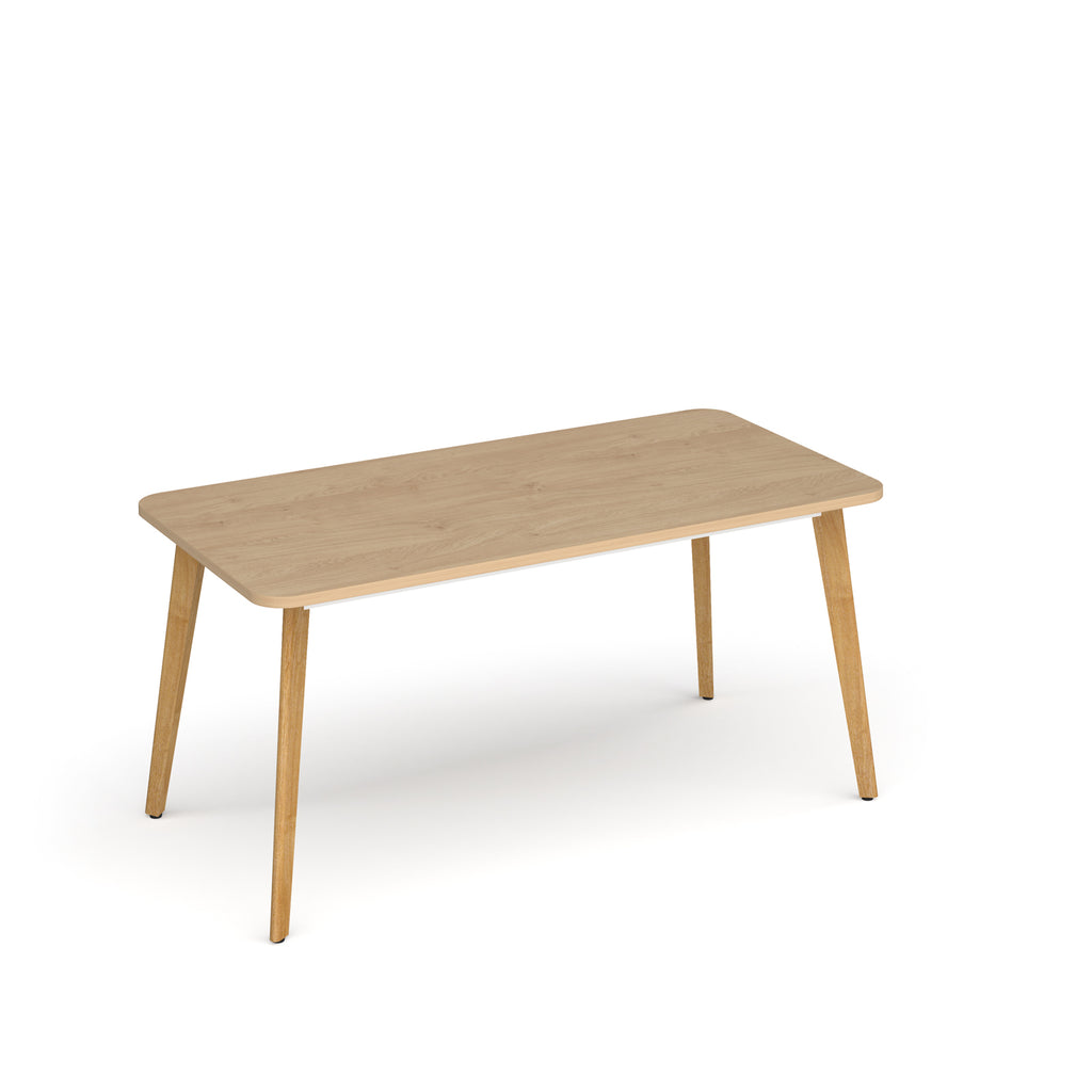 Wooden table with four legs on a white background