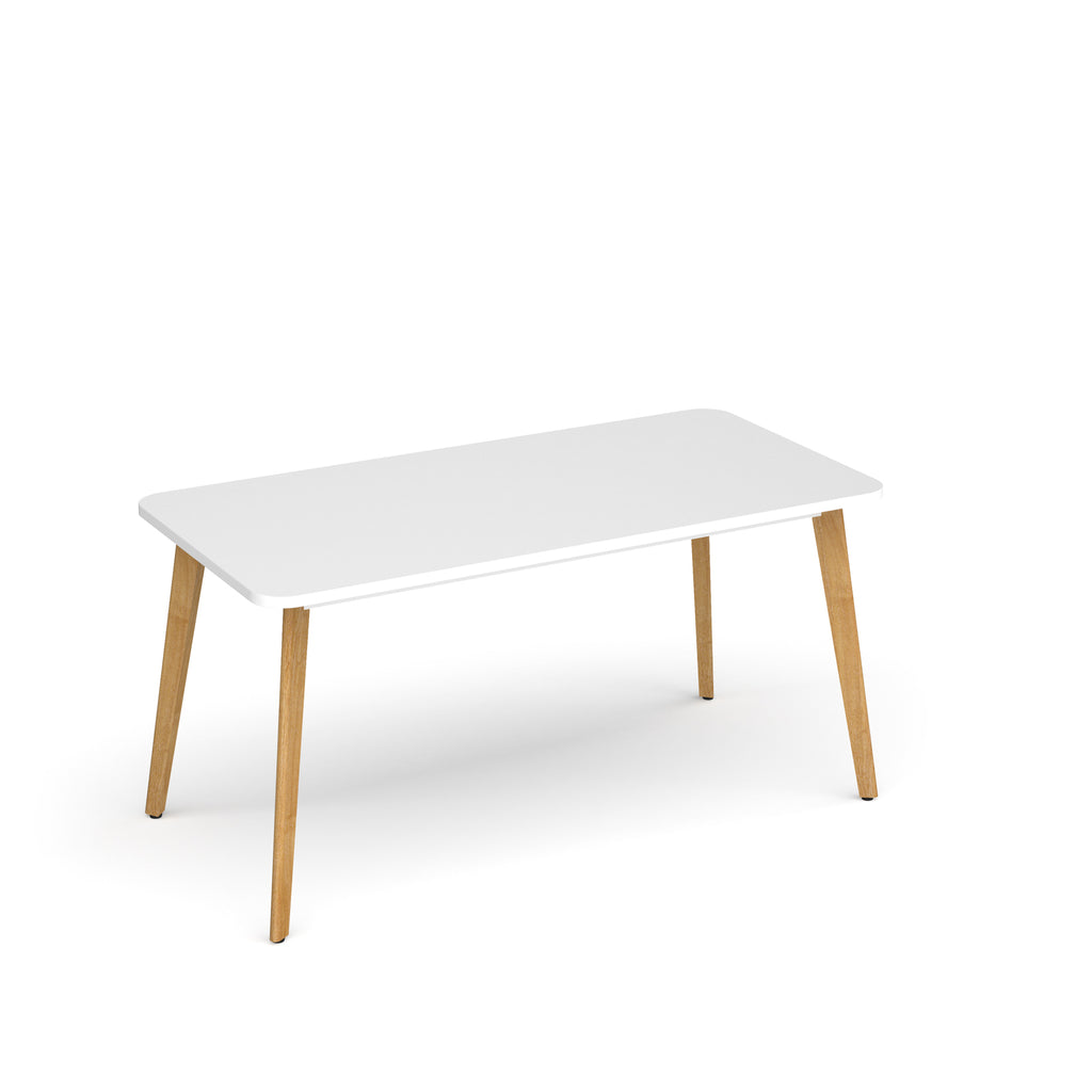 White table with wooden legs on a white background