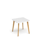 Small white table with wooden legs on a white background
