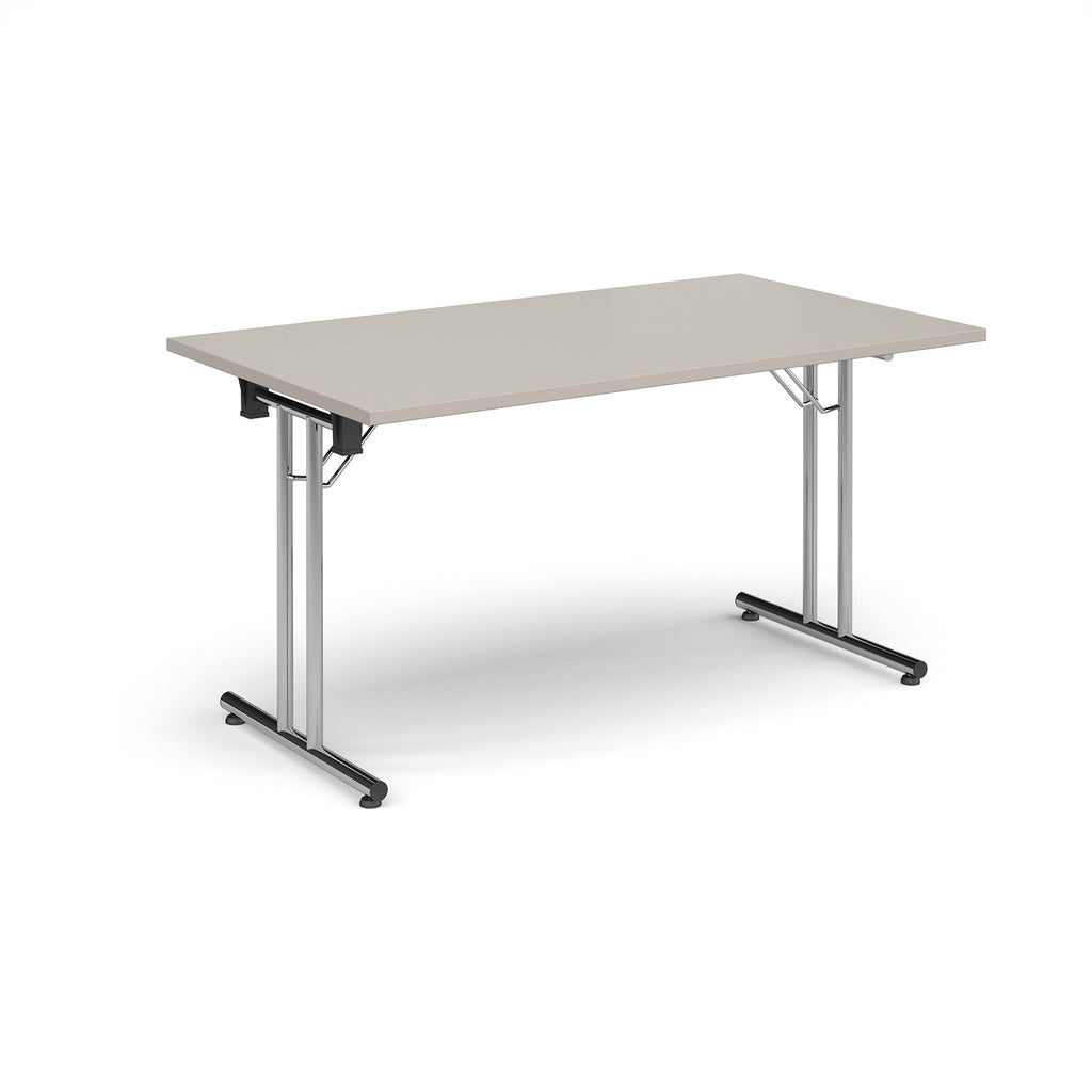 Folding table with light grey top and metal legs on a white background