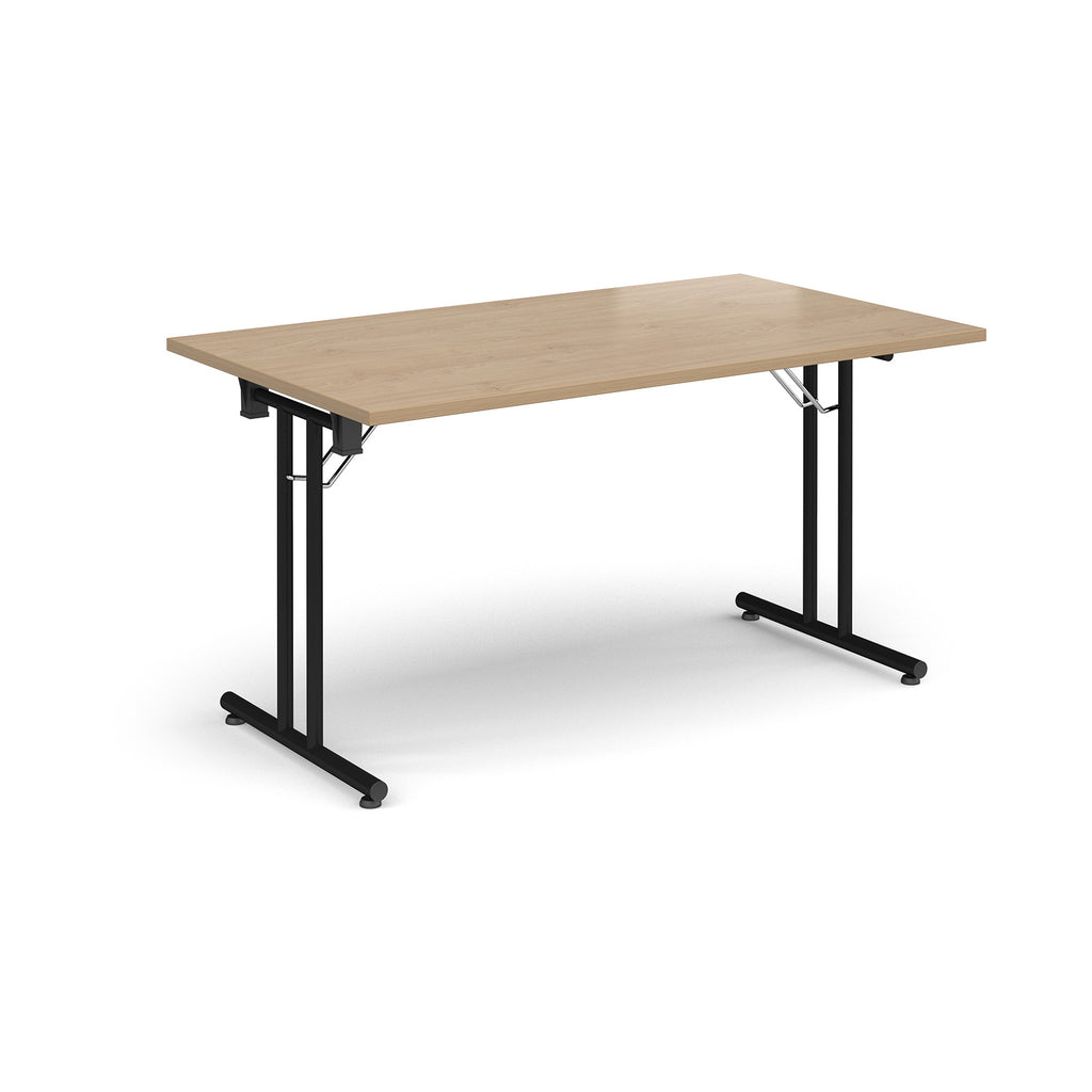 Folding table with wood-effect top and  black metal legs on a white background
