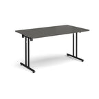 Folding table with grey top and black metal legs on a white background