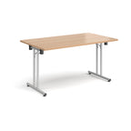Folding table with wood-effect top and metal legs on a white background