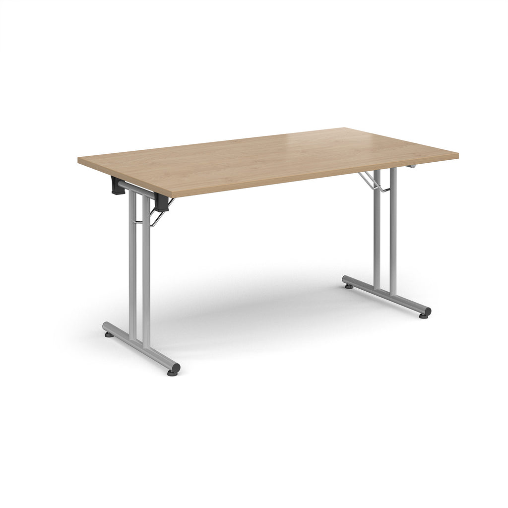 Folding table with wood-effect top and metal legs on a white background