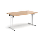 Folding table with wood-effect top and white metal legs on a white background