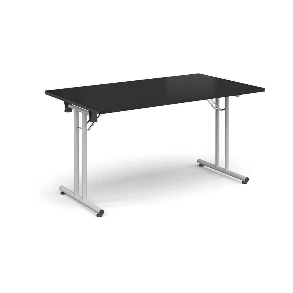 Folding table with black top and white metal legs on a white background