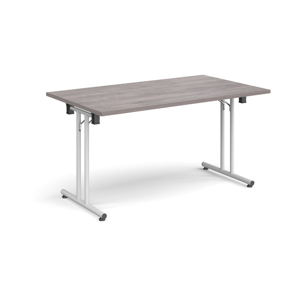 Folding table with grey wood-effect top and white metal legs on a white background