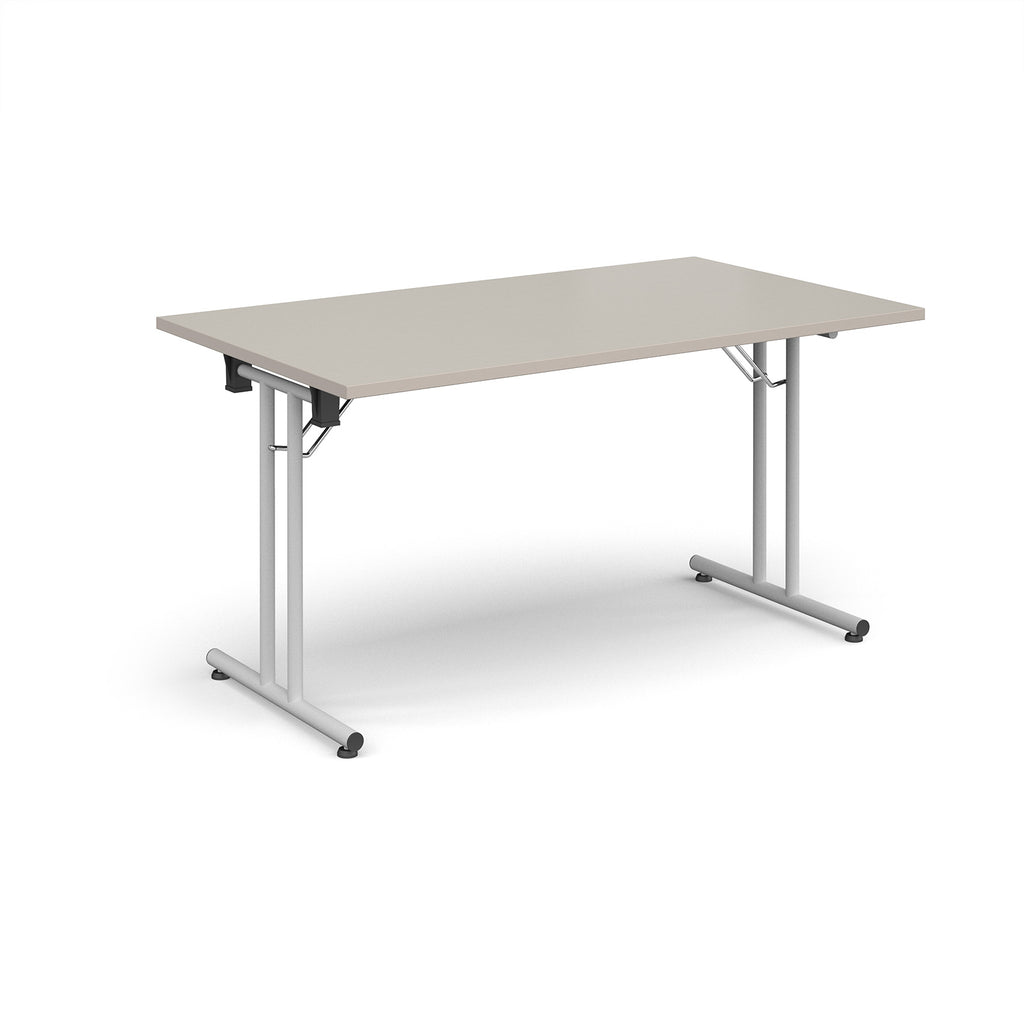 Folding table with light grey top and white metal legs on a white background
