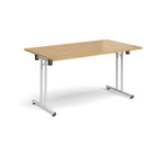 Folding table with wood-effect top and white metal legs on a white background