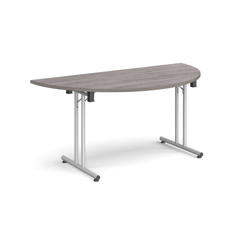 Semi-circular wooden flip-top table with silver metal legs, shown against a white background. Ideal for flexible meeting or training room layouts.