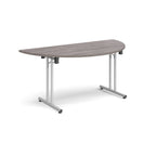 Semi-circular wooden flip-top table with silver metal legs, shown against a white background. Ideal for flexible meeting or training room layouts.