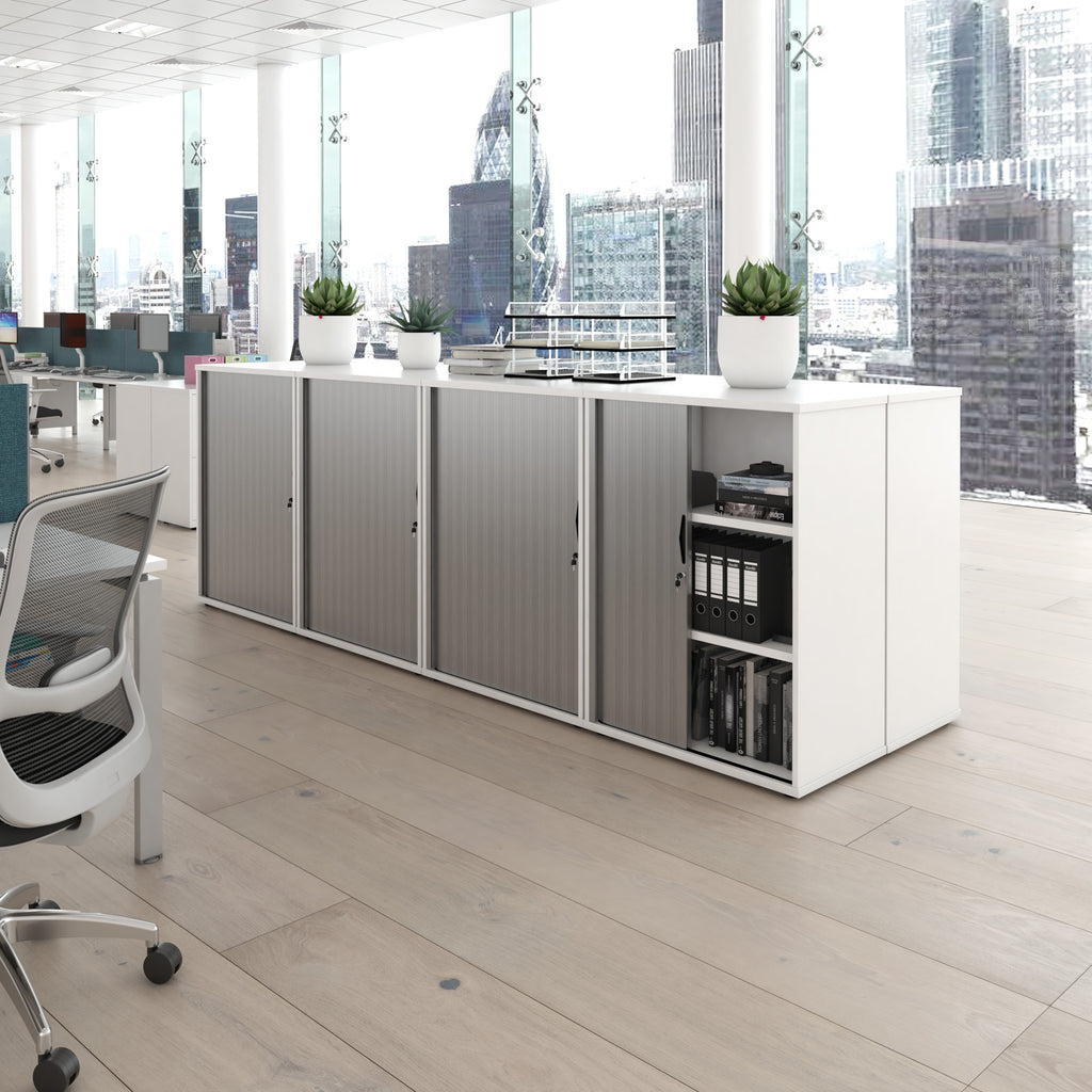 Modern office setup with a desk, chairs, and cabinets in a cityscape view.