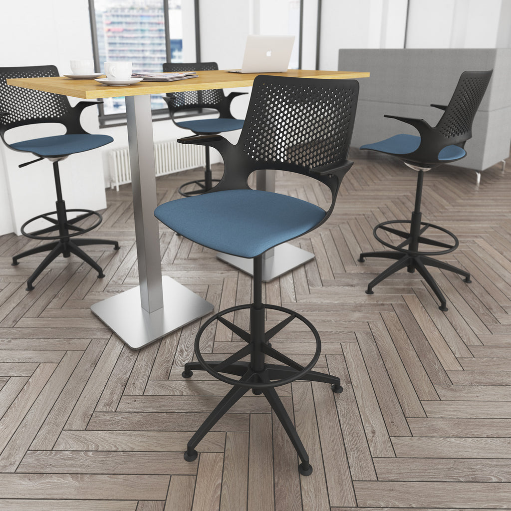 Modern office chairs with blue seats and black frames around a wooden table on a wooden floor.