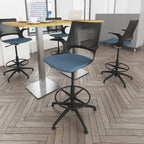 Modern office chairs with blue seats and black frames around a wooden table on a wooden floor.