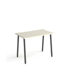 Minimalist rectangular office desk with white tabletop and angled black legs, shown against a white background.