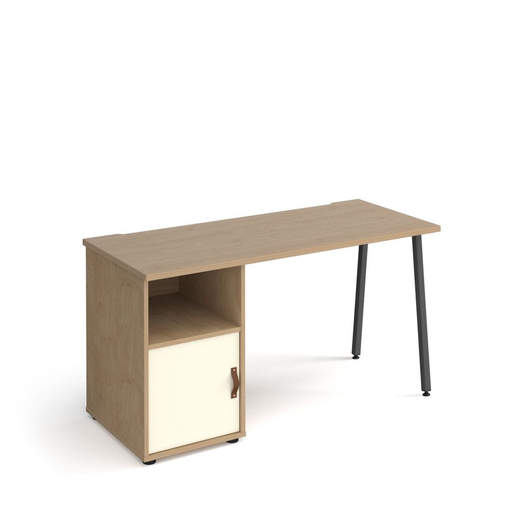 Office desk with oak-effect top, integrated storage cupboard with white door and shelf, and black angled legs, shown against a white background.