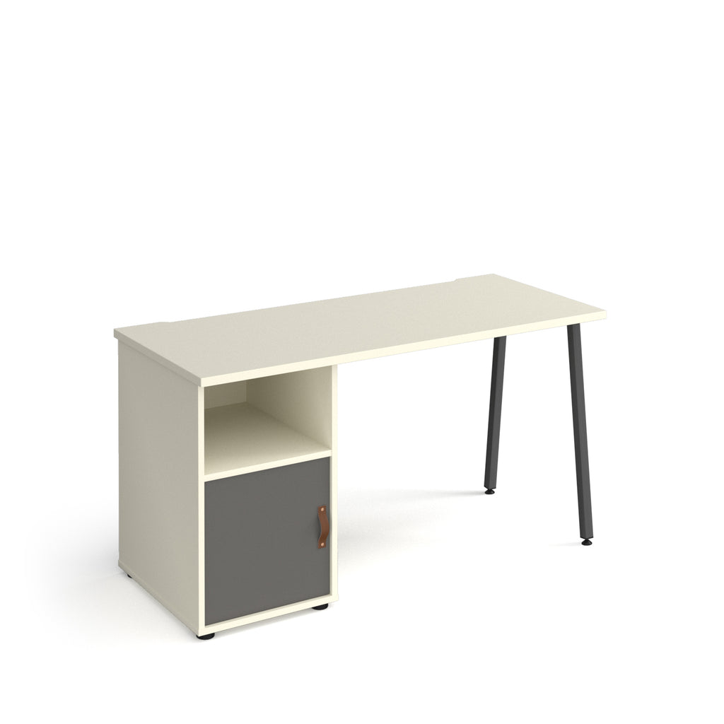 Office desk with white tabletop, integrated storage unit with grey cupboard door and shelf, and black angled legs on a white background.