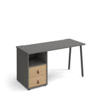 Office desk with grey tabletop, integrated two-drawer storage with wood-effect doors and shelf, and black angled legs on a white background.