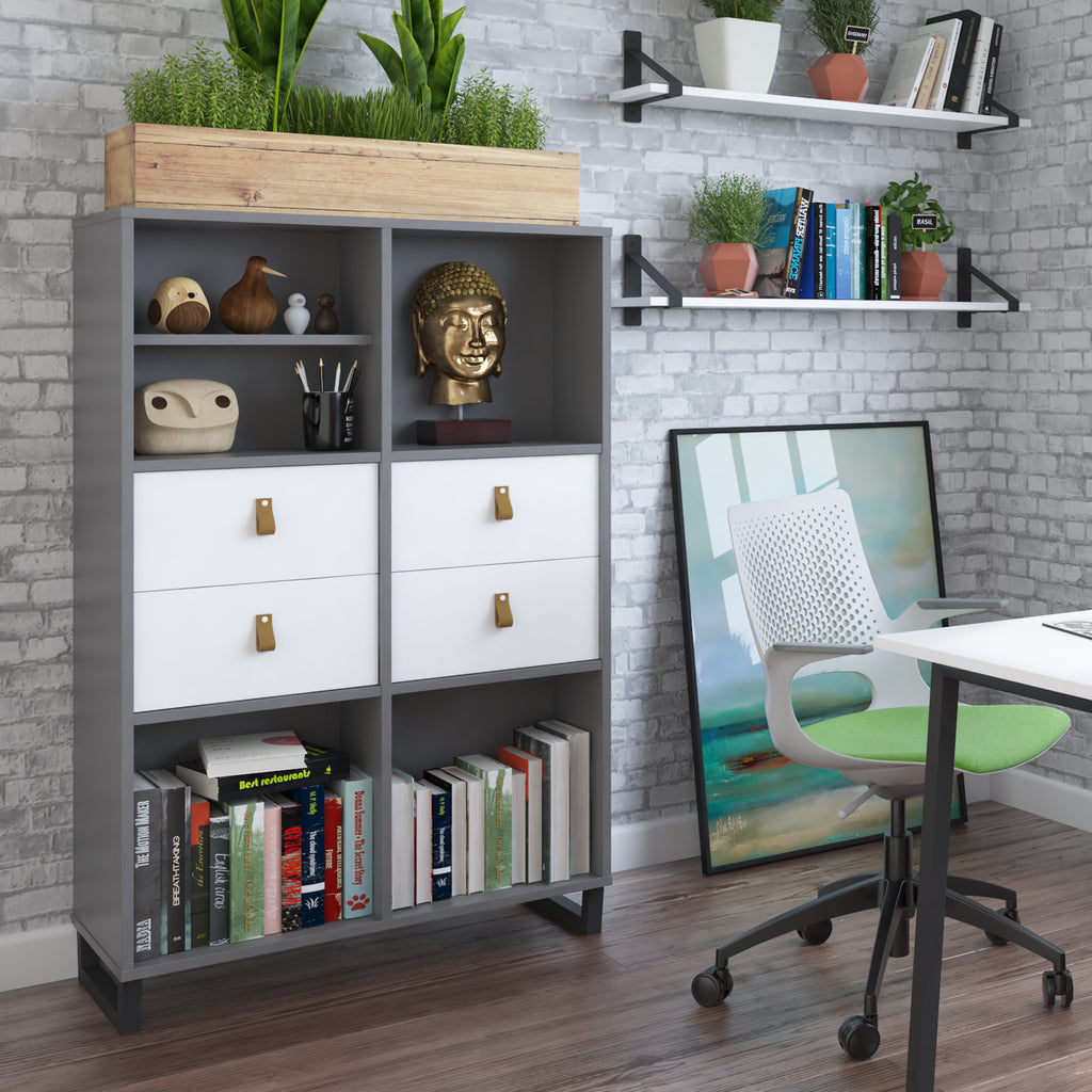 Modern office storage unit with open shelves, drawers, books, and decorative plants, styled in a contemporary workspace setting.