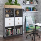 Modern office storage unit with open shelves, drawers, books, and decorative plants, styled in a contemporary workspace setting.