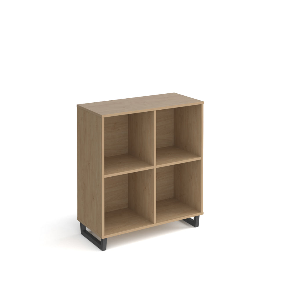 Wood-effect open storage unit with four cubby compartments and black metal base, shown against a white background.