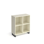 White open storage unit with four cubby compartments and black metal base, shown against a white background.