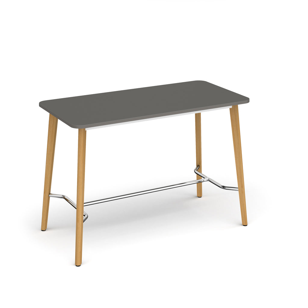 Rectangular table with grey top, angled wooden legs, and chrome footrest bar, shown against a white background.