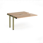 Modular bench desk add-on with a wood-effect top, integrated cable access cut-out, and green metal legs, shown on a white background.