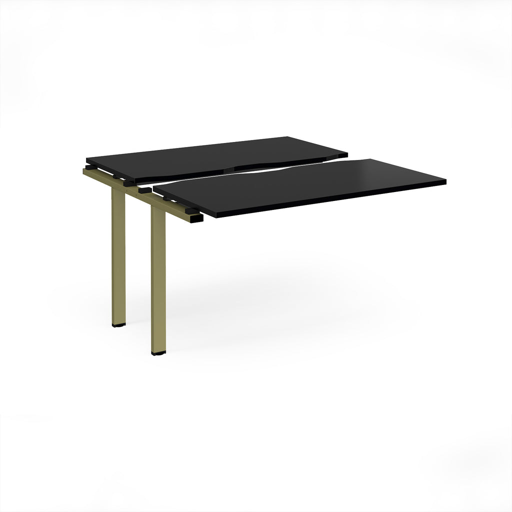 Modular bench desk add-on with a black top, integrated cable access cut-out, and green metal legs, shown on a white background.