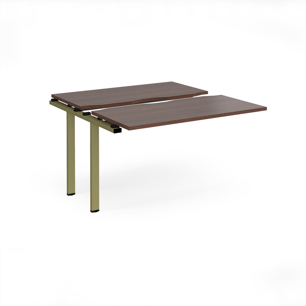 Modular bench desk add-on with a dark wood-effect top, integrated cable access cut-out, and green metal legs, shown on a white background.