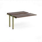 Modular bench desk add-on with a dark wood-effect top, integrated cable access cut-out, and green metal legs, shown on a white background.