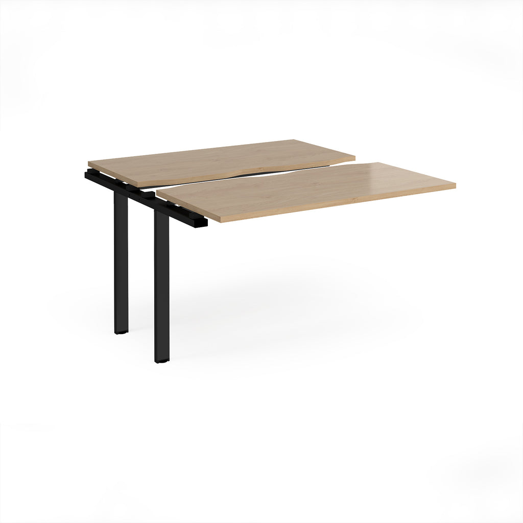 Modular bench desk add-on with a wood-effect top, integrated cable access cut-out, and black metal legs, shown on a white background.