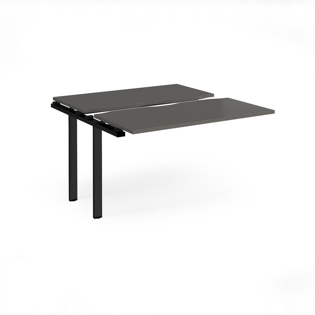 Modular bench desk add-on with a grey top, integrated cable access cut-out, and black metal legs, shown on a white background.