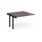 Modular bench desk add-on with a dark wood-effect top, integrated cable access cut-out, and black metal legs, shown on a white background.
