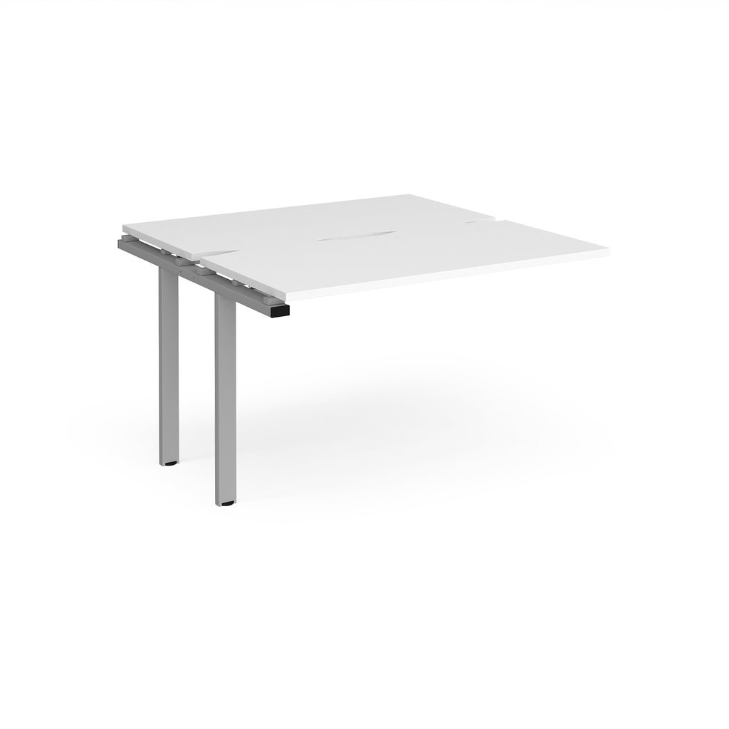 Modular bench desk add-on with a white top, integrated cable access cut-out, and silver metal legs, shown on a white background.