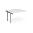 Modular bench desk add-on with a white top, integrated cable access cut-out, and silver metal legs, shown on a white background.