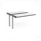 Modular bench desk add-on with a white top with black edging, integrated cable access cut-out, and white metal legs, shown on a white background.