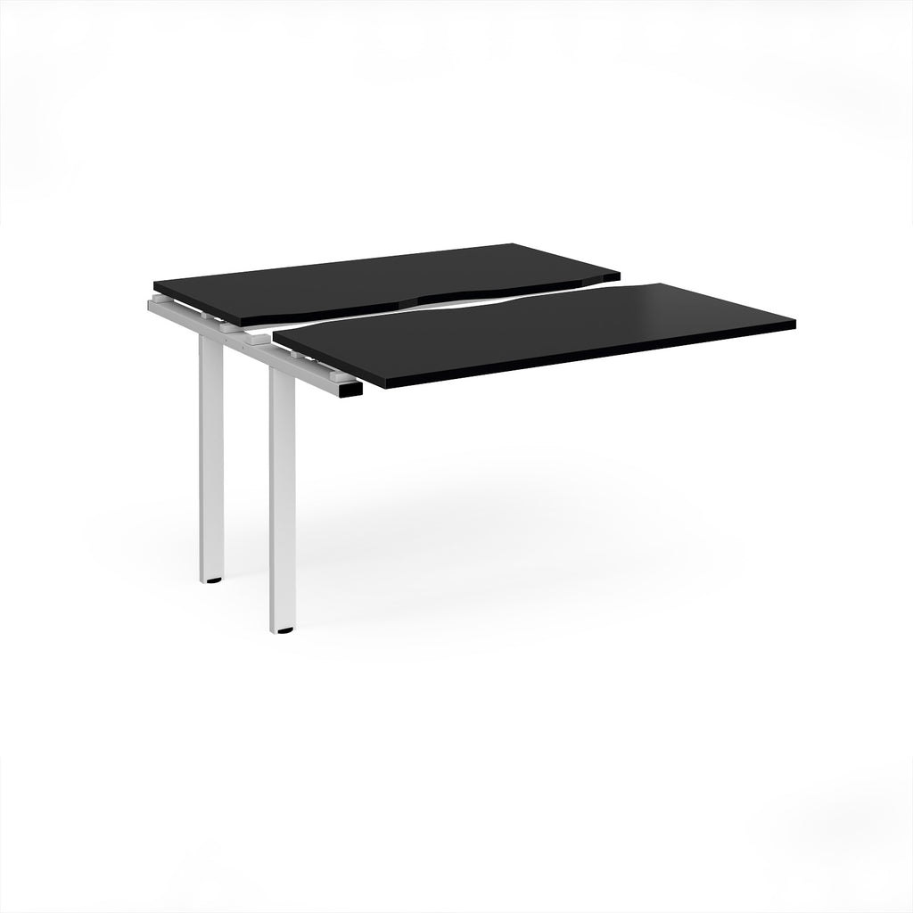 Modular bench desk add-on with a black top, integrated cable access cut-out, and white metal legs, shown on a white background.