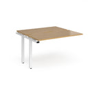 Modular bench desk add-on with a wood-effect top, integrated cable access cut-out, and white metal legs, shown on a white background.