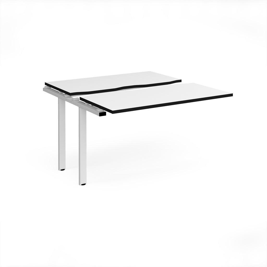 Modular bench desk add-on with a white top with black edging, integrated cable access cut-out, and white metal legs, shown on a white background.