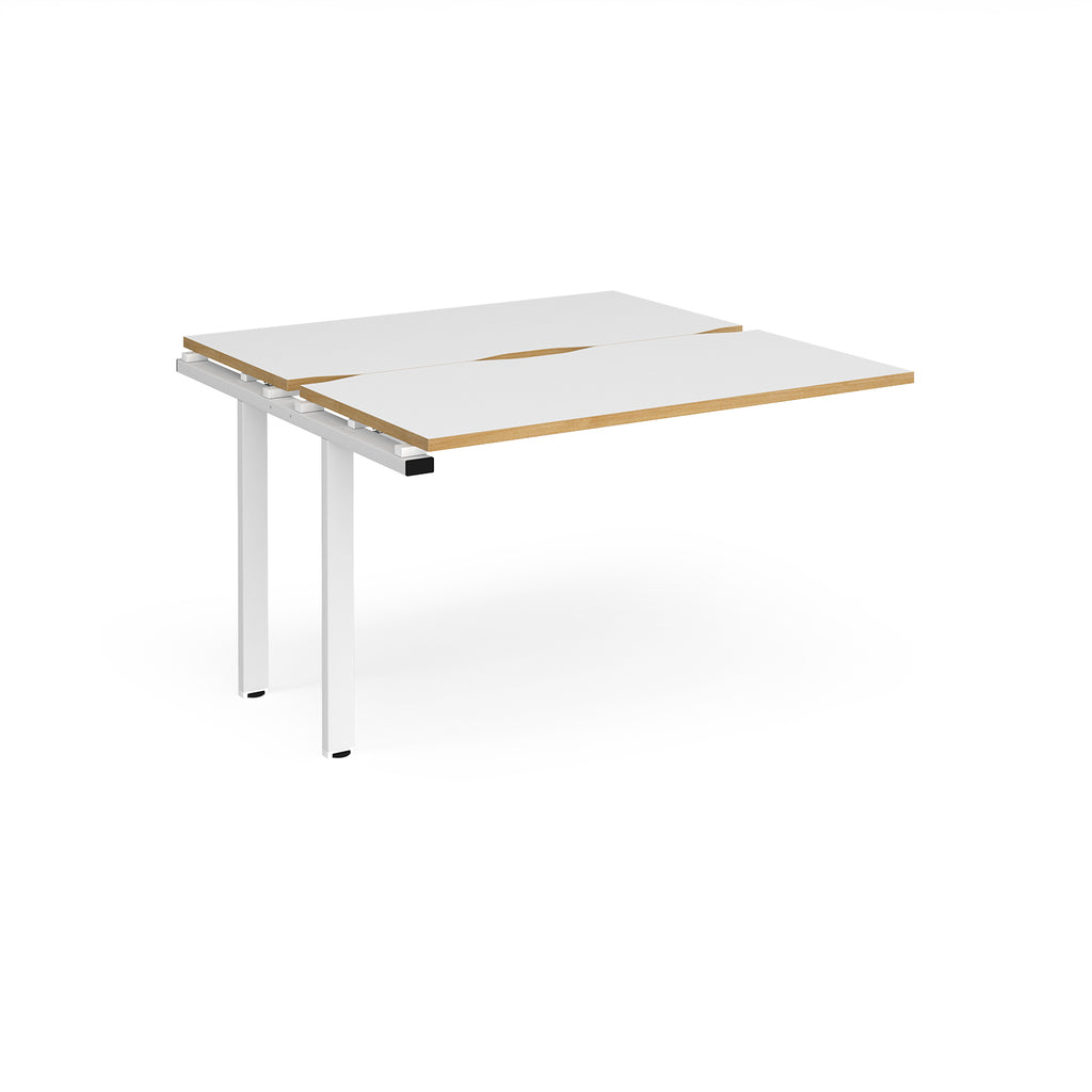 Modular bench desk add-on with white top with wood-effect edging, integrated cable access cut-out, and white metal legs, shown on a white background.