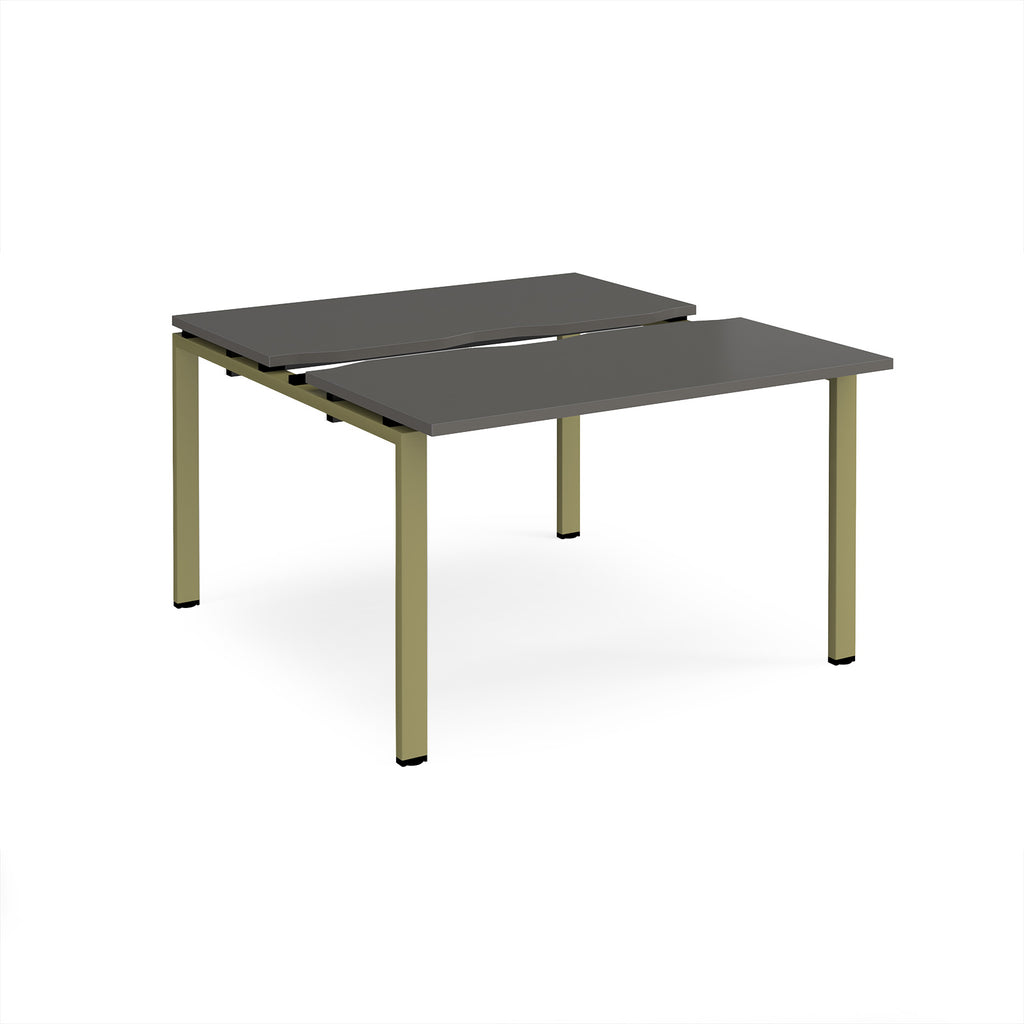 Two-person back-to-back office desk with grey worktops and green metal legs, shown against a white background.